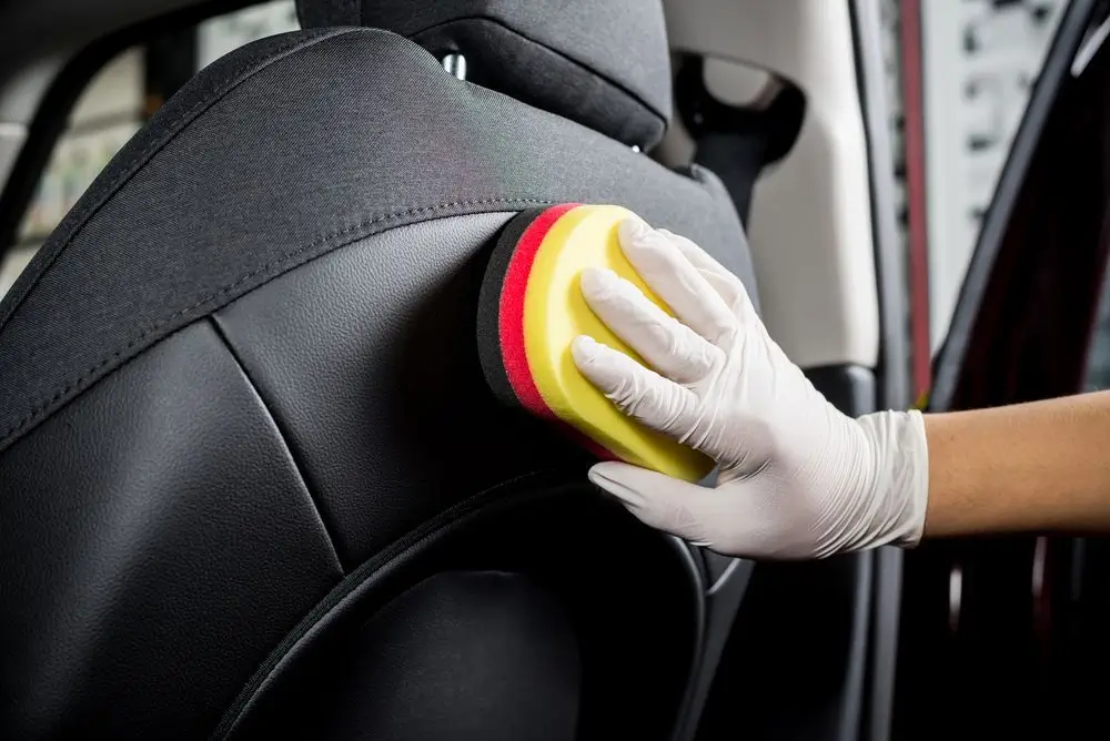 Technician installing clear paint protection film on car bonnet in Townsville for stone chip defence